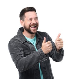 Photo of Handsome man laughing and showing thumbs up on white background. Positive emotion