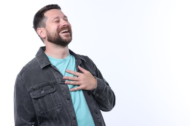 Photo of Handsome man laughing on white background. Positive emotion
