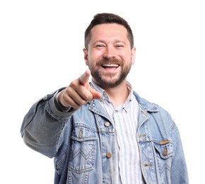 Photo of Handsome man laughing and pointing at something on white background. Positive emotion