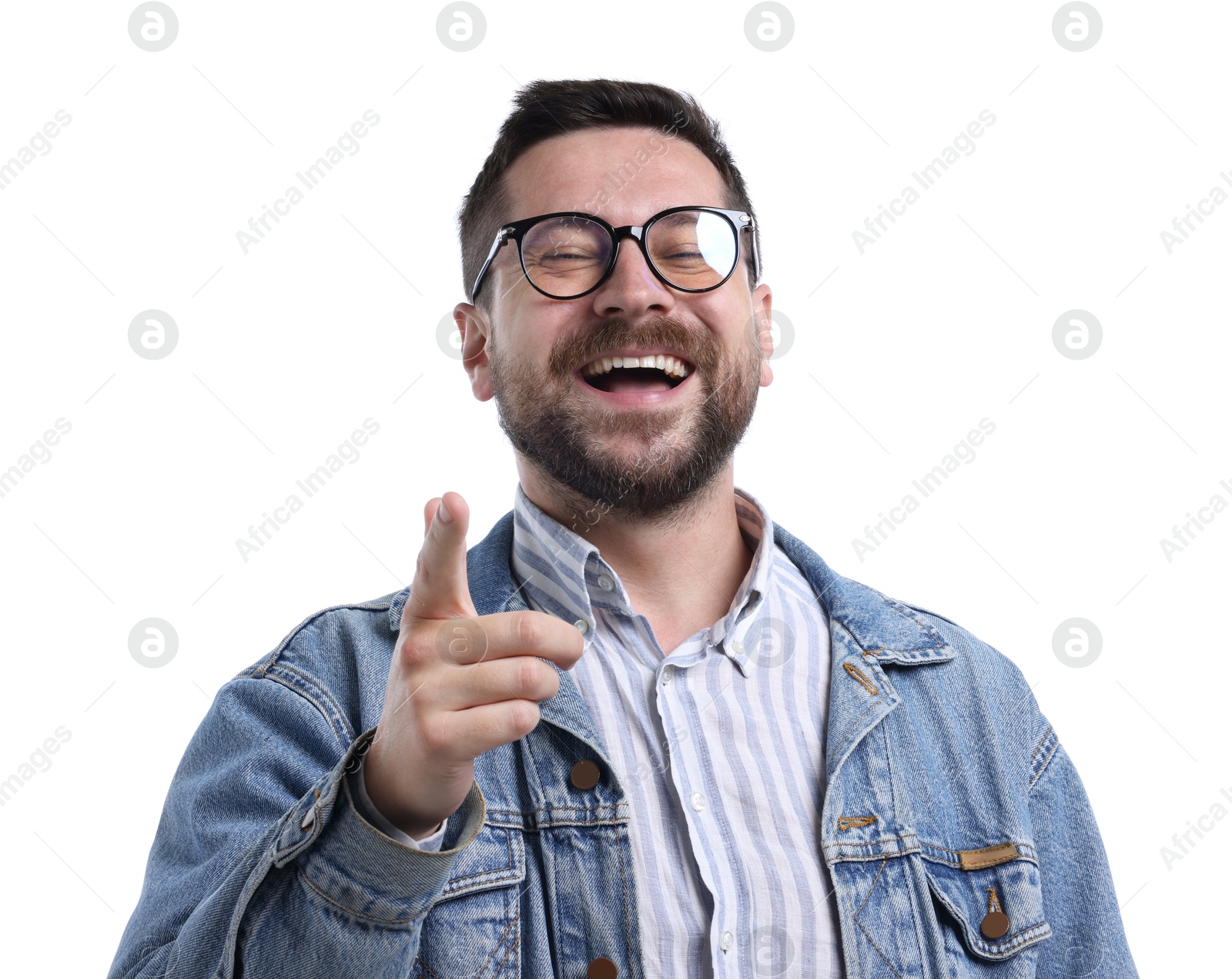 Photo of Handsome man laughing and pointing at something on white background. Positive emotion