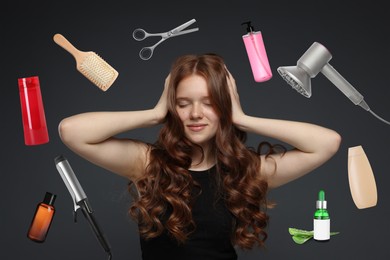 Image of Young girl with beautiful hair on black background. Different hair care products and tools flying around her