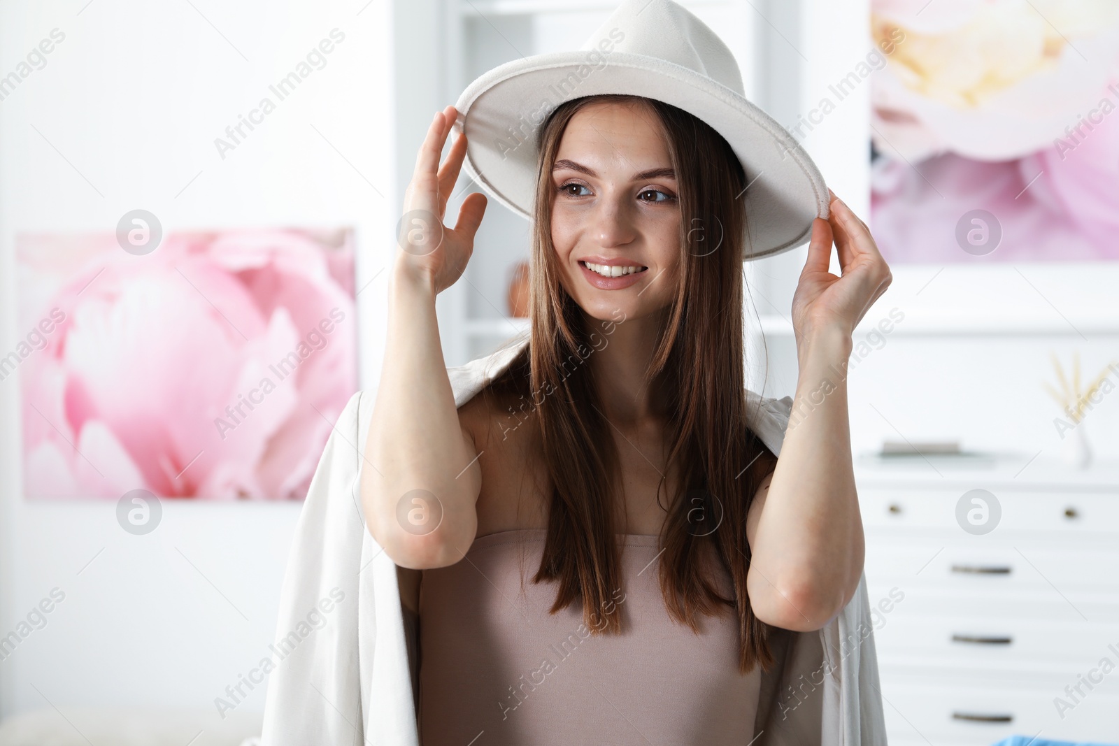Getting ready. Young woman in stylish clothes at home Photo of Getting ready. Young woman in stylish clothes at home