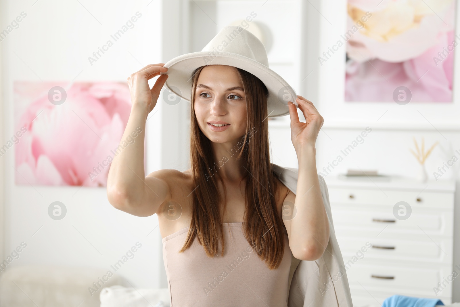 Getting ready. Young woman in stylish clothes at home Photo of Getting ready. Young woman in stylish clothes at home