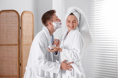 Photo of Young couple getting ready together at home