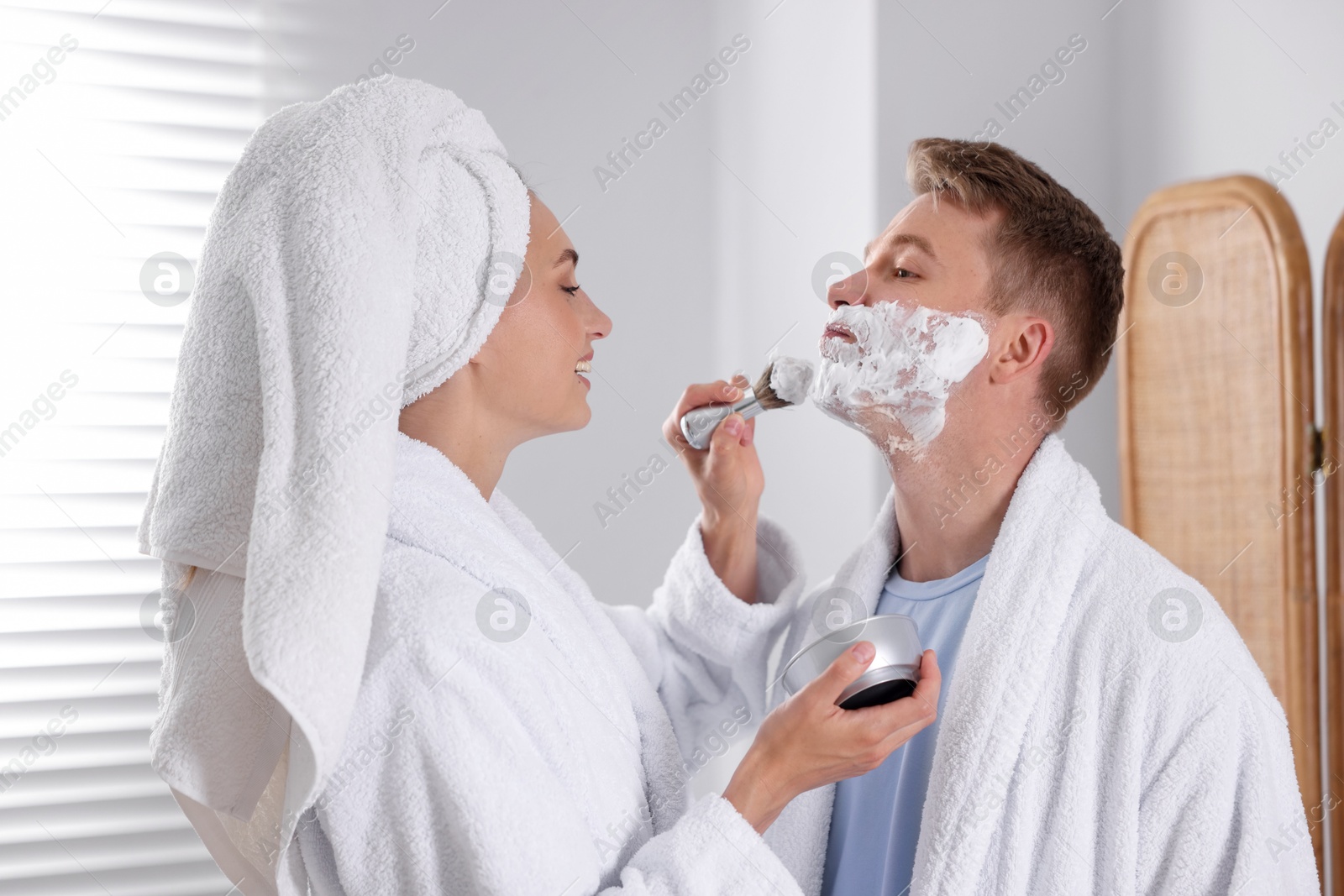 Photo of Young couple getting ready together at home