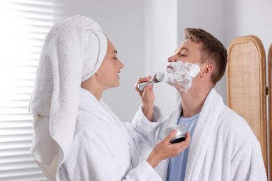 Photo of Young couple getting ready together at home