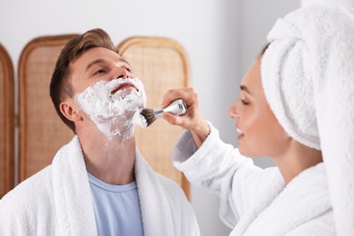 Photo of Young couple getting ready together at home