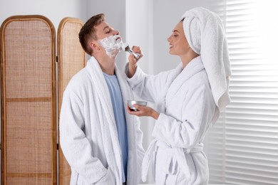 Photo of Young couple getting ready together at home