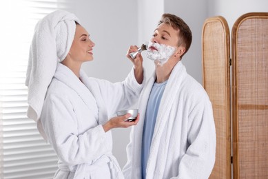 Photo of Young couple getting ready together at home