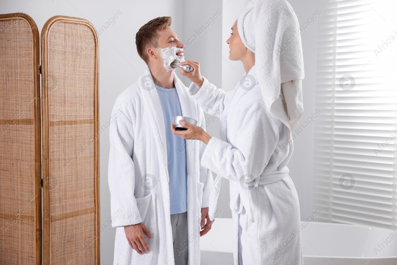 Young couple getting ready together at home Photo of Young couple getting ready together at home