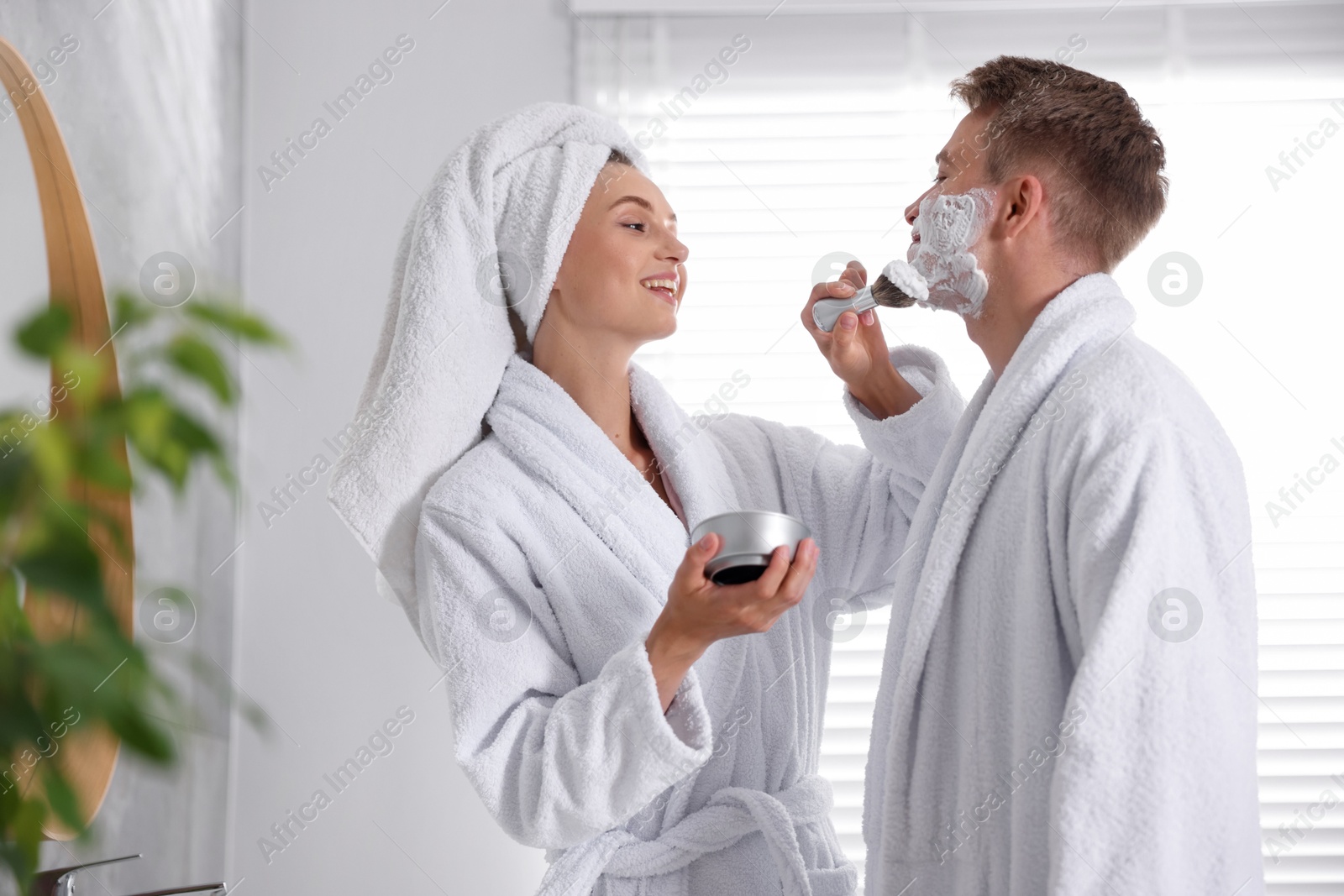 Young couple getting ready together at home Photo of Young couple getting ready together at home