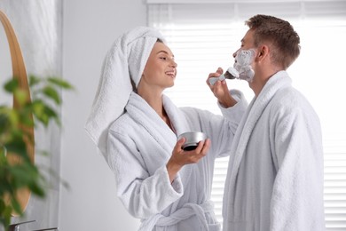 Photo of Young couple getting ready together at home