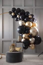 Photo of Stylish photo zone with balloons and decor in studio
