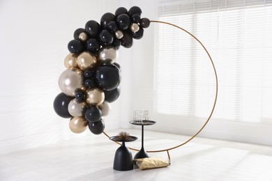 Photo of Stylish photo zone with balloons and decor in studio