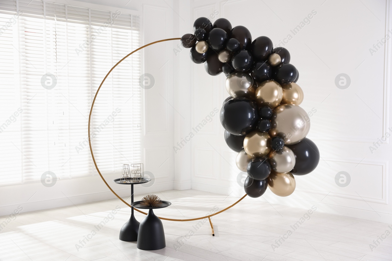 Photo of Stylish photo zone with balloons and decor in studio