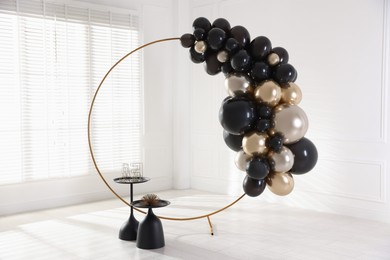 Photo of Stylish photo zone with balloons and decor in studio