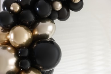 Photo of Stylish photo zone with balloons and decor in studio, closeup. Space for text
