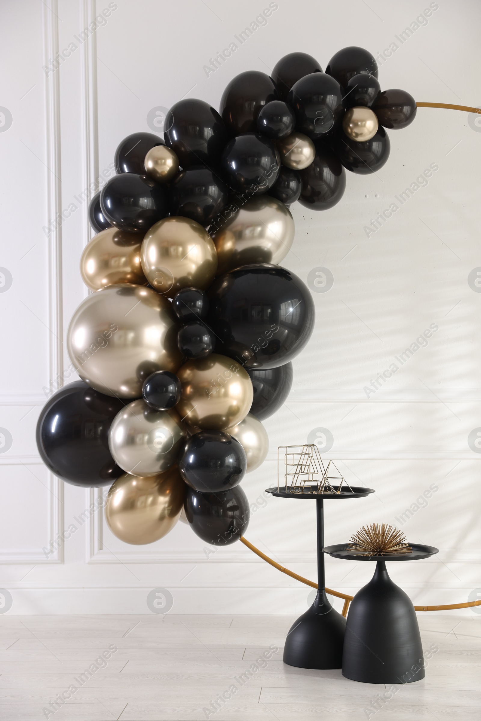 Photo of Stylish photo zone with balloons and decor in studio