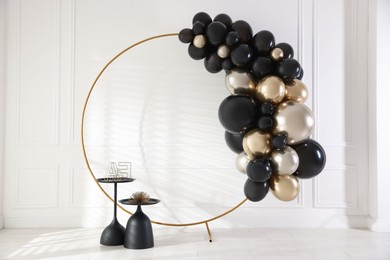 Photo of Stylish photo zone with balloons and decor in studio
