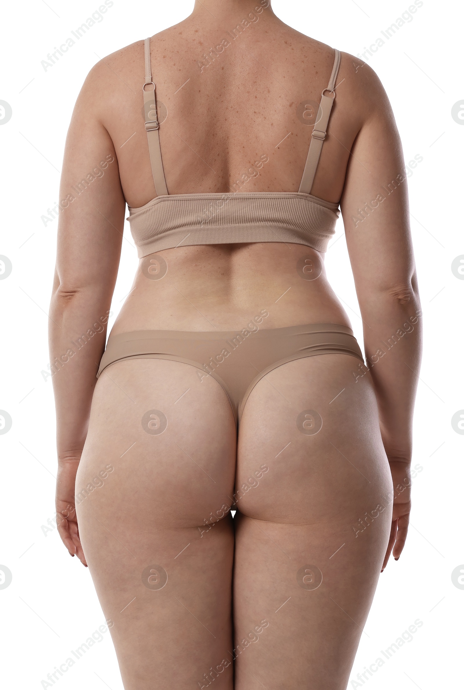 Woman in underwear on white background, back view Photo of Woman in underwear on white background, back view