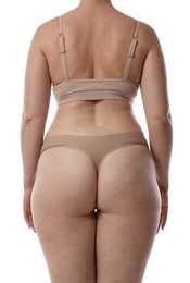 Photo of Woman in underwear on white background, back view