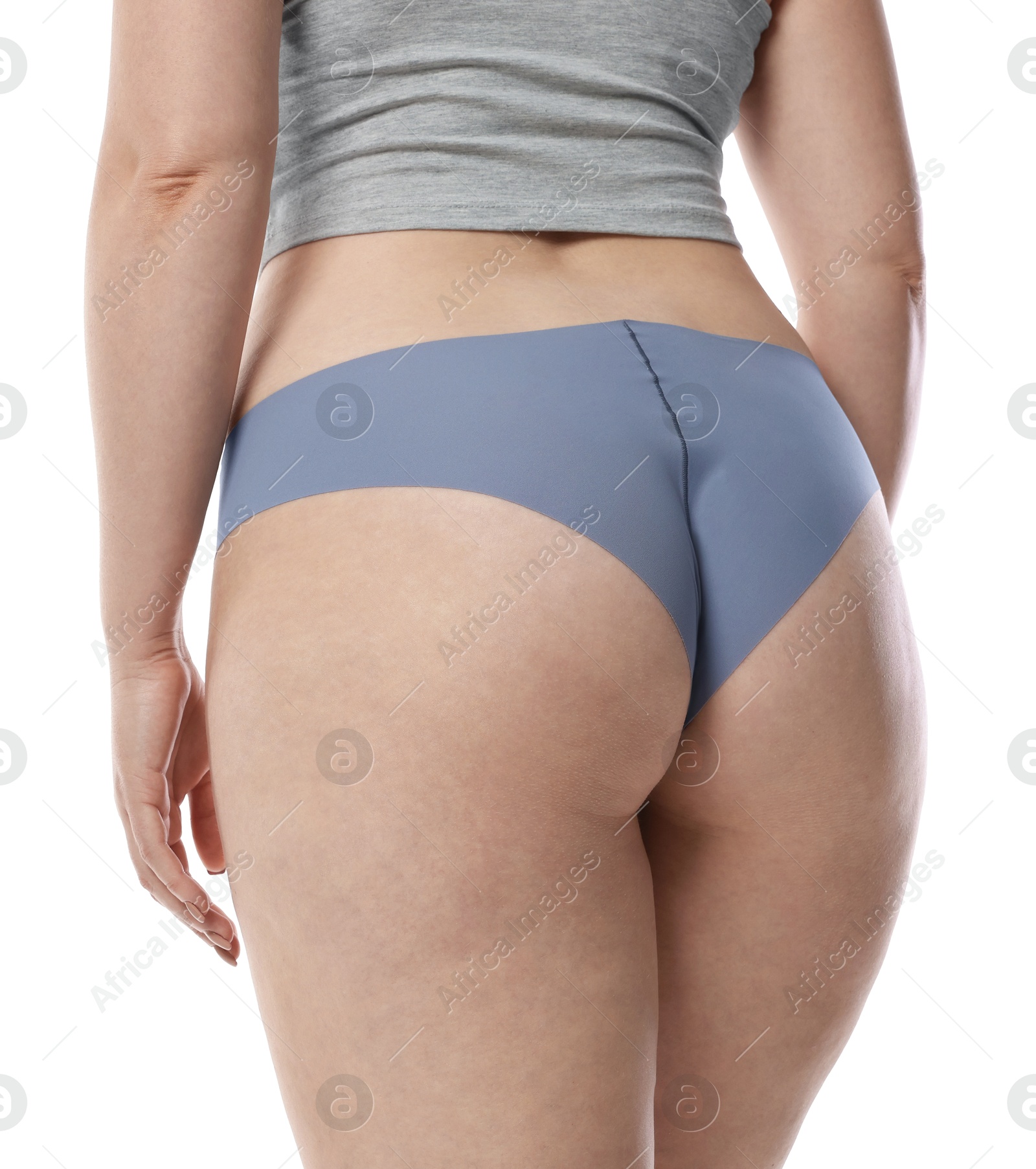 Woman in underwear on white background, back view Photo of Woman in underwear on white background, back view