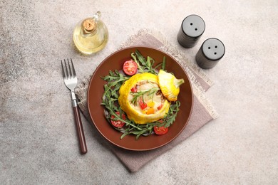 Photo of Tasty stuffed pattypan squash with tomatoes and arugula served on grey table, flat lay