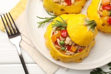 Photo of Tasty stuffed pattypan squashes served on white wooden table, flat lay