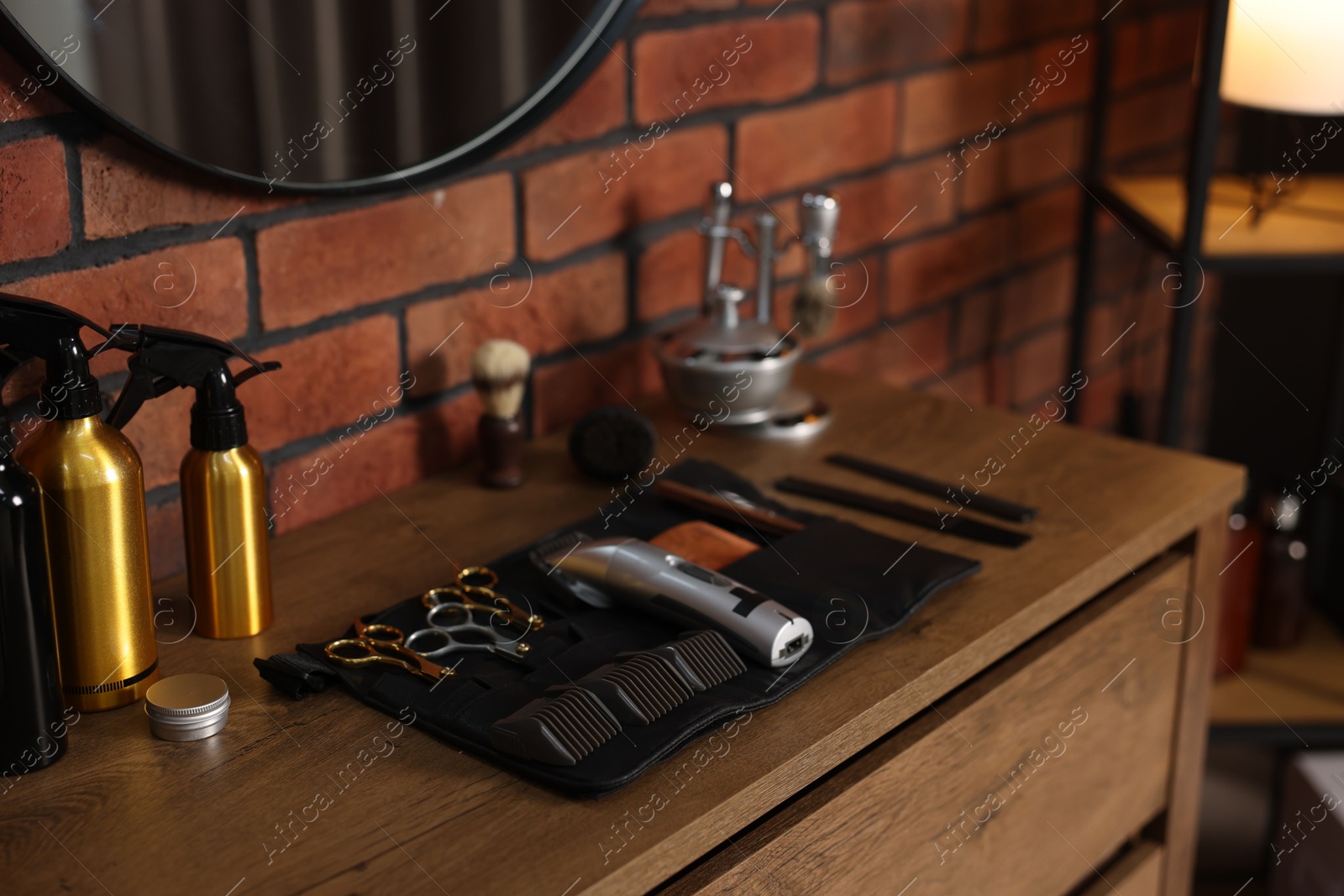 Different barber's tools on wooden cabinet in barbershop, closeup Photo of Different barber's tools on wooden cabinet in barbershop, closeup