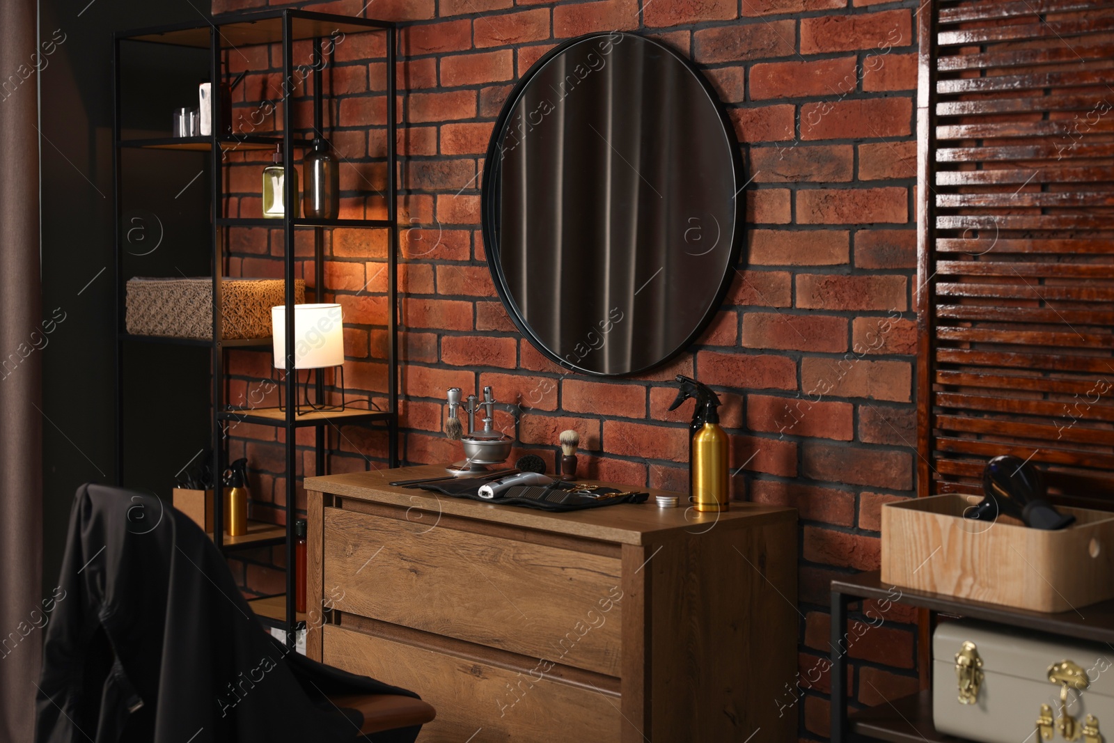 Different barber's tools on wooden cabinet and mirror in barbershop Photo of Different barber's tools on wooden cabinet and mirror in barbershop