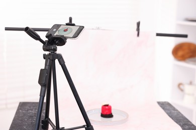 Photo of Shooting tasty dessert with smartphone in studio, selective focus. Professional food photography