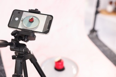 Photo of Shooting tasty dessert with smartphone in studio, selective focus. Professional food photography
