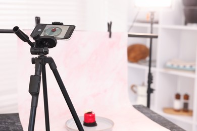 Photo of Shooting tasty dessert with smartphone in studio, selective focus. Professional food photography