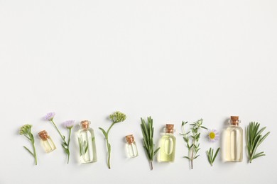 Photo of Essential oils and different plants on white background, flat lay. Space for text