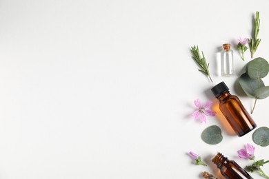 Photo of Essential oils and different plants on white background, flat lay. Space for text