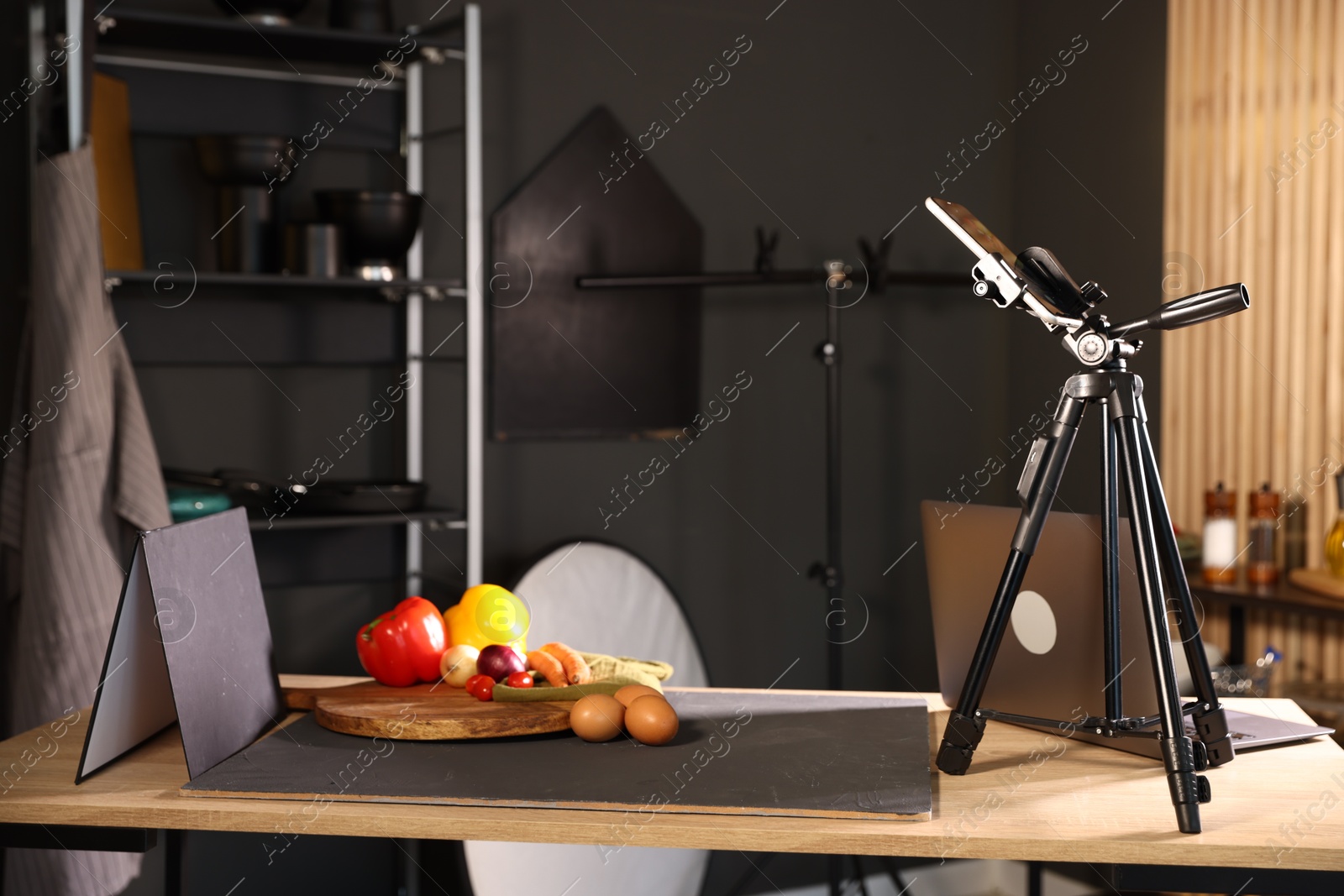Photo of Shooting vegetables with smartphone in studio. Professional food photography