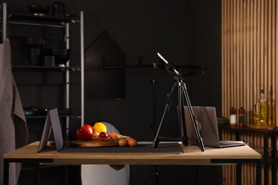 Photo of Shooting vegetables with smartphone in studio. Professional food photography