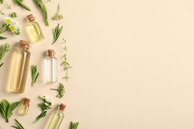 Photo of Essential oils and different plants on beige background, flat lay. Space for text