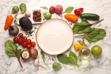 Photo of Healthy vegetarian food. Empty plate surrounded by different products on white marble table, flat lay