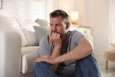 Photo of Man suffering from panic attack at home