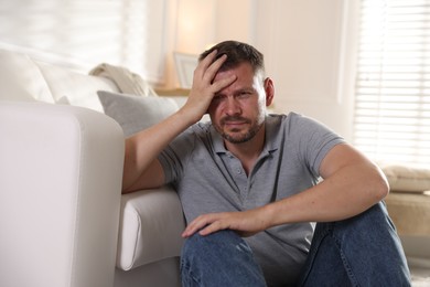 Photo of Man suffering from panic attack at home