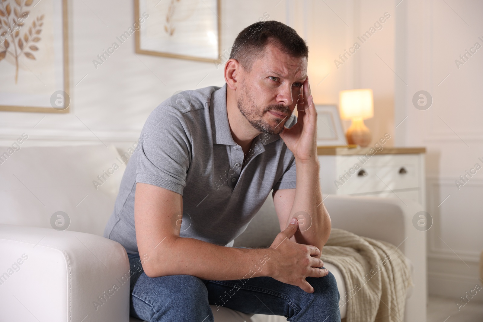 Man suffering from panic attack at home Photo of Man suffering from panic attack at home