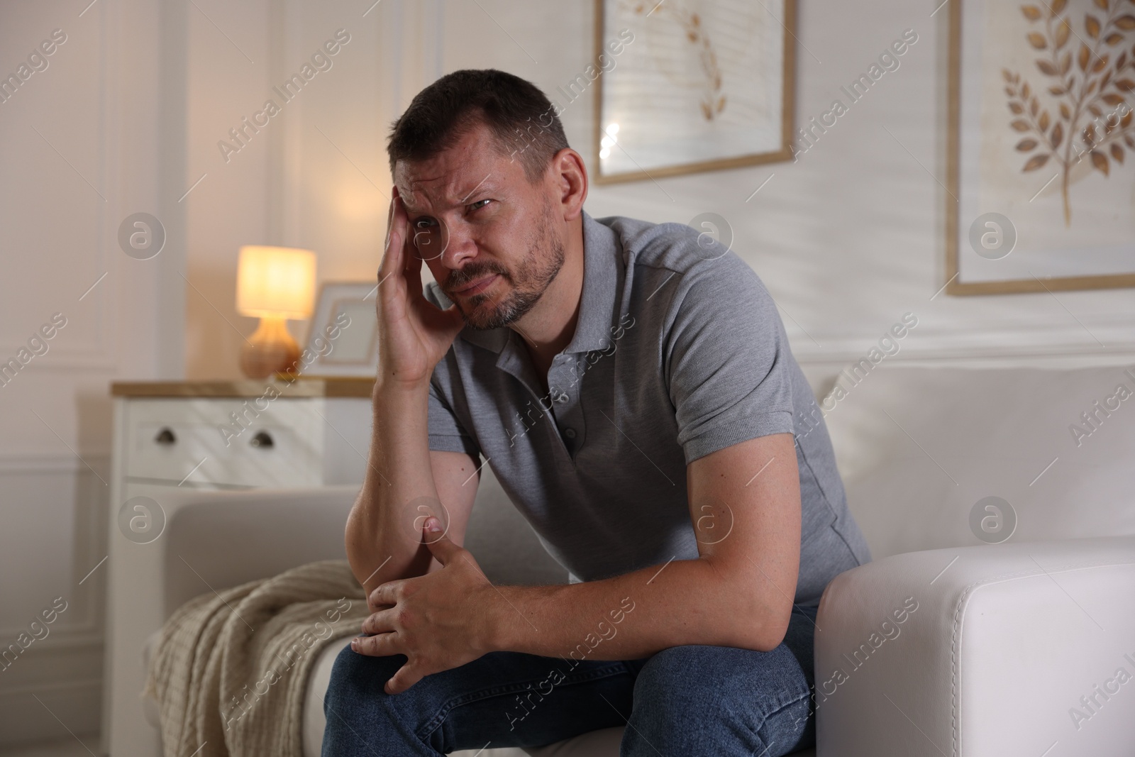 Man suffering from panic attack at home Photo of Man suffering from panic attack at home
