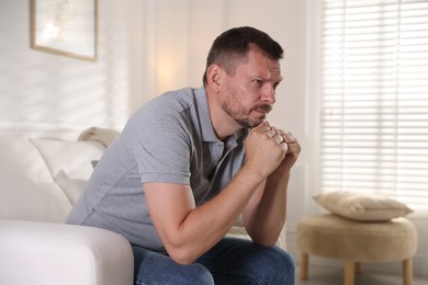Photo of Man suffering from panic attack at home