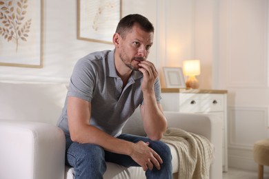 Photo of Man suffering from panic attack at home
