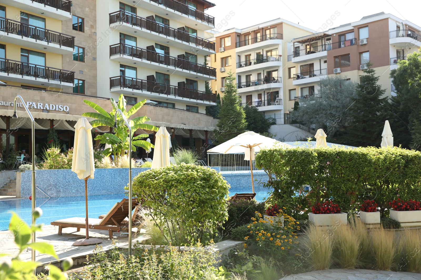 Photo of Sveti Vlas, Bulgaria - July 13, 2025: Beautiful Paradiso hotel with swimming pool, sunbeds and different green plants