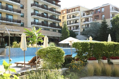 Photo of Sveti Vlas, Bulgaria - July 13, 2025: Beautiful Paradiso hotel with swimming pool, sunbeds and different green plants