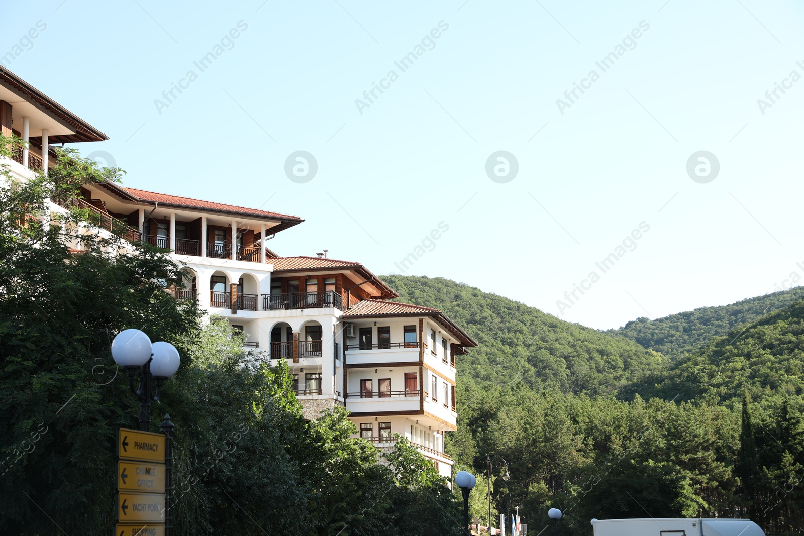 Photo of Sveti Vlas, Bulgaria - July 13, 2025: Beautiful hotel and green mountains, low angle view