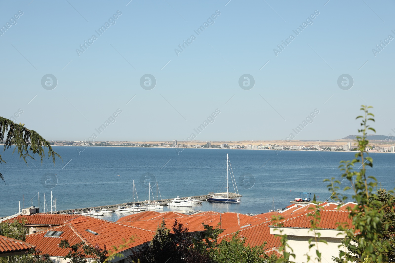 Photo of Sveti Vlas, Bulgaria - July 13, 2025: Beautiful seascape with moored boats and buildings