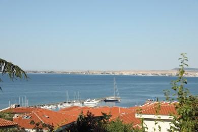 Photo of Sveti Vlas, Bulgaria - July 13, 2025: Beautiful seascape with moored boats and buildings